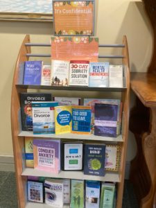 Image of confidential corner, with books like 30 Day Sobriety Solution, Divorce, Gender Identity, and more. 